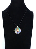 Colgante Intencionado Protección Buda Gautama (Siddharta). Color piedra turquesa y lapislázuli. Arte Tibetano. - www.eltercerojo.cl