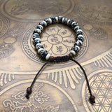 Pulsera hueso de Yak con símbolo Om. - www.eltercerojo.cl