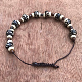 Pulsera hueso de Yak con símbolo Om. - www.eltercerojo.cl