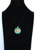 Colgante Intencionado Protección Buda Gautama (Siddharta). Color piedra turquesa y coral . Arte Tibetano. - www.eltercerojo.cl